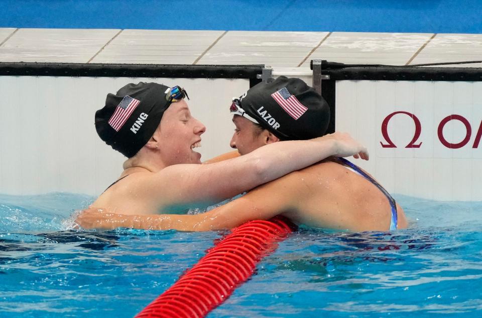 U.S. swimmers Lilly King and Annie Lazor celebrate their medal-winning performances in the women's 200-meter breaststroke at Tokyo Aquatics Centre.