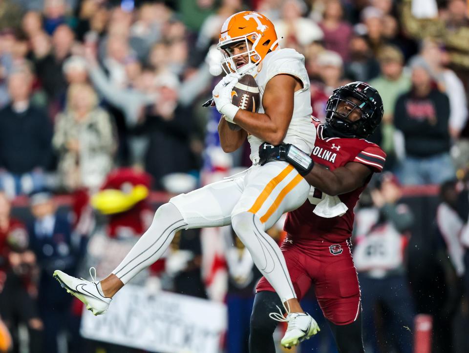 Tennessee wide receiver Bru McCoy (15) makes a touchdown reception against South Carolina defensive back Darius Rush (28) during the second quarter at Williams-Brice Stadium.