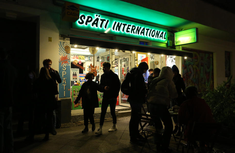 BERLIN, GERMANY - OCTOBER 10: Late night shop customers make their final beer purchases at 11pm on the first night of the implementation of new safety regulations after coronavirus cases rose to over 4000 a day in the country, on October 10, 2020 in Berlin, Germany. Bars, restaurants, and late night shops will have to close between the hours of 11pm and 6am; pharmacies and gas stations may remain open, but alcohol sales are prohibited. Meanwhile outdoor public gatherings of more than five people from more than one household are prohibited. The restrictions are planned to last until the end of the month, and establishments that break the rules may be fined up to €5,000 ($5,900).  (Photo by Adam Berry/Getty Images)