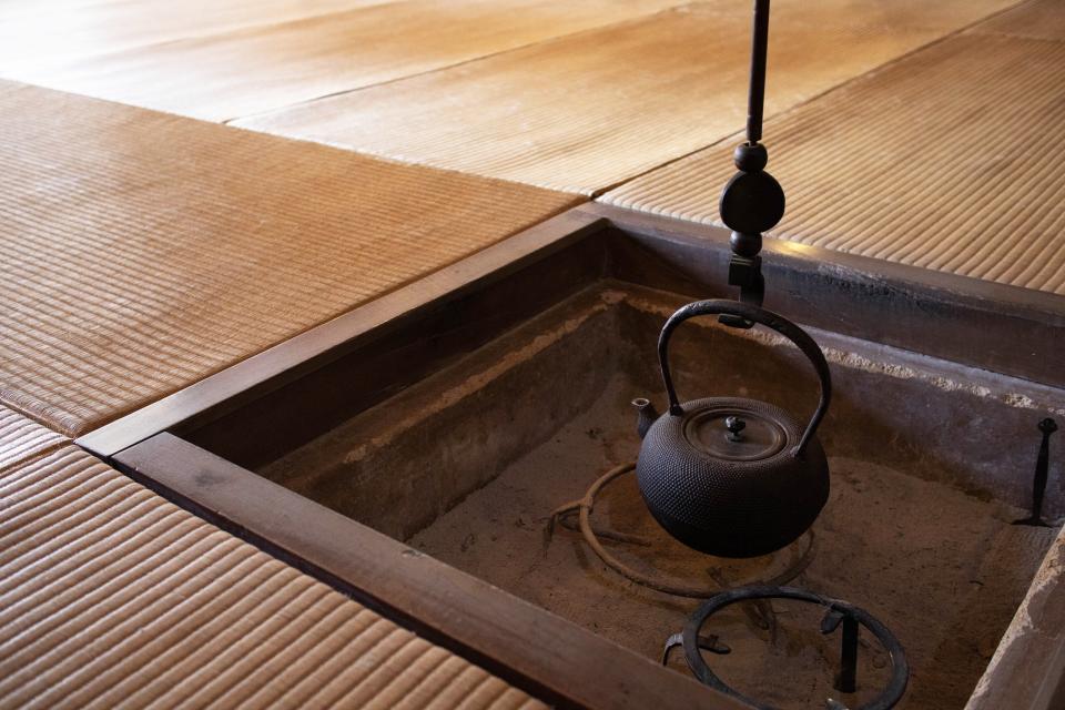 Traditional Japanese tatami mats around a sunken hearth.