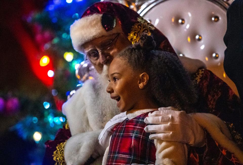 6-year-old Zayla of Palm Desert shares a moment with Santa Claus during the tree lighting ceremony in La Quinta in 2022.