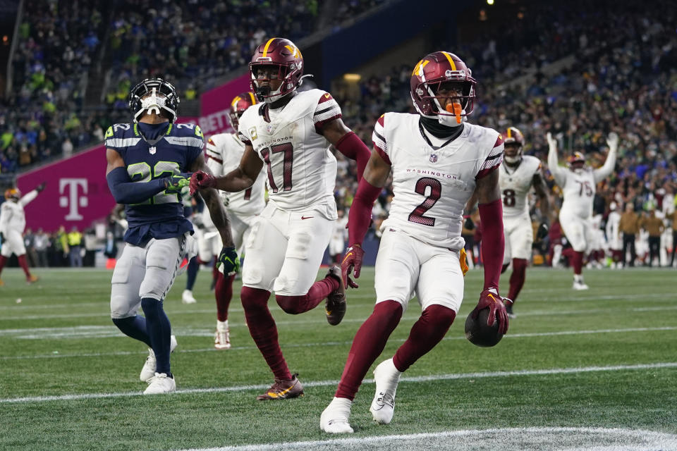 Washington Commanders wide receiver Dyami Brown (2) scores a touchdown in the second half of an NFL football game against the Seattle Seahawks in Seattle, Sunday, Nov. 12, 2023. (AP Photo/Lindsey Wasson)