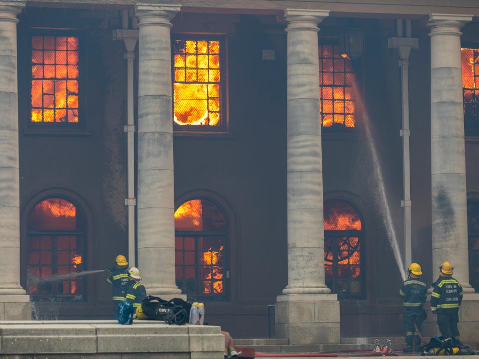 <p>Firefighters battle a blaze that destroyed the nearly 200-year-old Jagger Library on the University of Cape Town campus</p> (EPA)