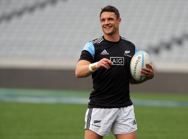 Dan Carter kicking ball in super 14 rugby union game at the