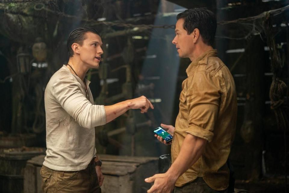 tom holland as nathan drake and mark wahlberg as victor sullivan in uncharted