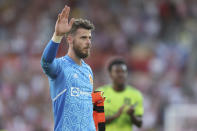 Manchester United's goalkeeper David de Gea waves to his team supporters after the end of the English Premier League soccer match between Brentford and Manchester United at the Gtech Community Stadium in London, Saturday, Aug. 13, 2022. Manchester United lost 0-4 .(AP Photo/Ian Walton)