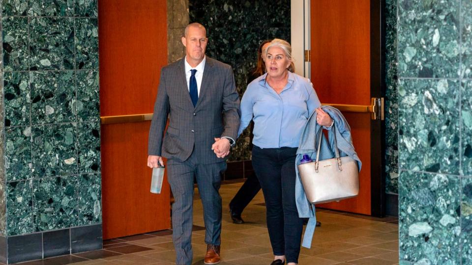 PHOTO: Paramedic Peter Cichuniec and his wife make their way to the courtroom in Brighton, CO, Dec. 1, 2023. (Philip B. Poston/AP)