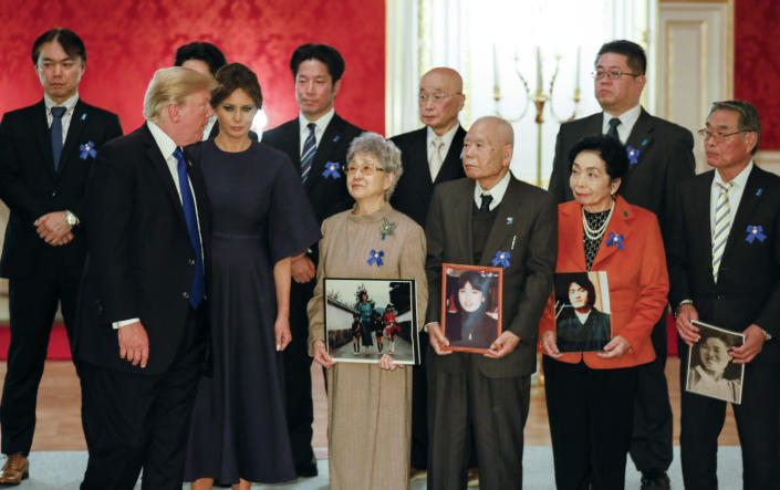 <p>President Donald Trump and First Lady Melania meets families of abductees by North Korea in Tokyo on Nov. 6, 2017.Trump met Sakie Yokota (front row C), 81, mother of Megumi Yokota who was abducted by North Korean agents in Japan when she was a 13-year-old junior high school student, and Megumi’s twin brothers Takuya and Tetsuya Yokota (Left behind of Sakie). (Photo: Kimimasa Mayama/AFP/Getty Images) </p>