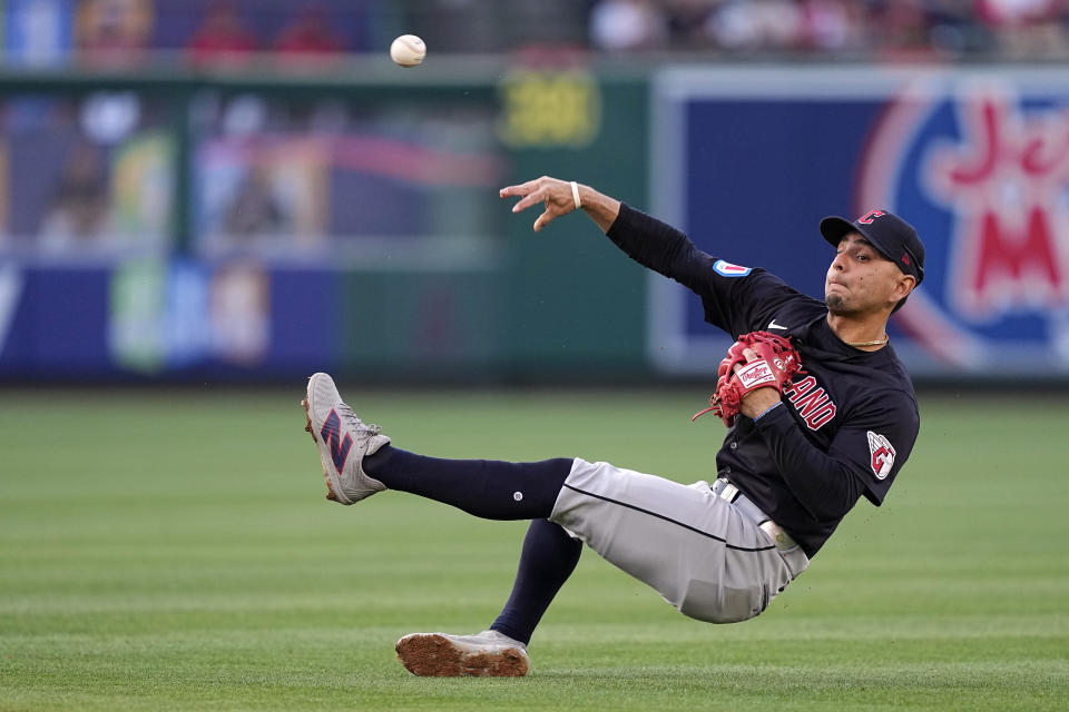 Cleveland Guardians second baseman Andres Gimenez attempts to throw out Los Angeles Angels' Kevin Pillar at first during the first inning of a baseball game Friday, May 24, 2024, in Anaheim, Calif. Pillar was safe at first on the play. (AP Photo/Mark J. Terrill)