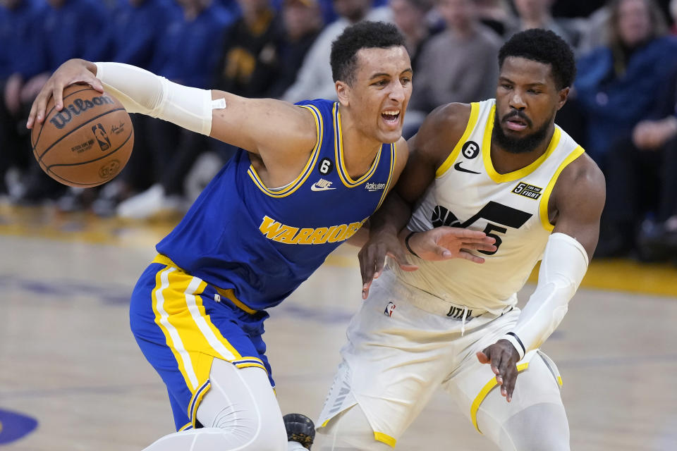 Golden State Warriors forward Patrick Baldwin Jr., left, drives to the basket against Utah Jazz guard Malik Beasley during the first half of an NBA basketball game in San Francisco, Wednesday, Dec. 28, 2022. (AP Photo/Jeff Chiu)