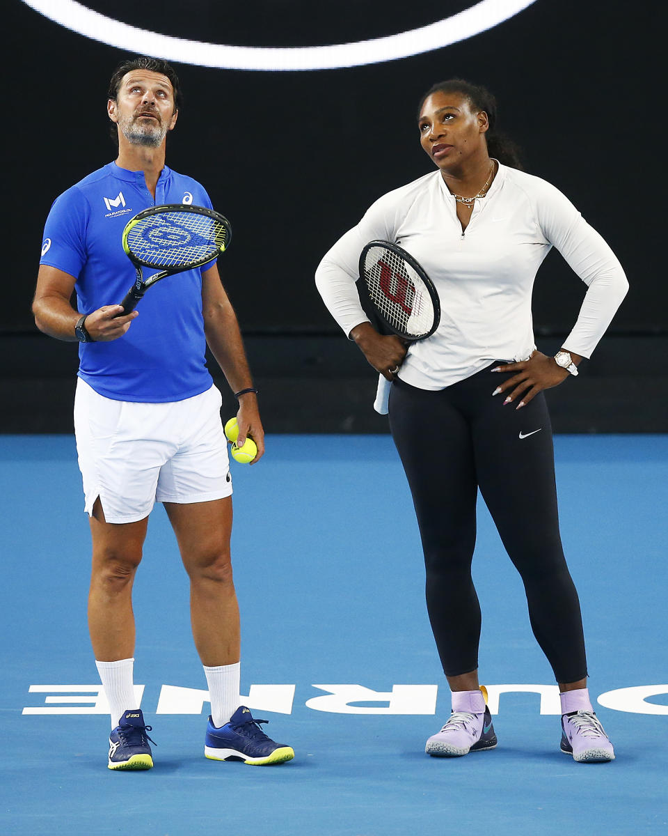 Serena Williams (pictured right) speaking with coach Patrick Mouratoglou (pictured right) during training.