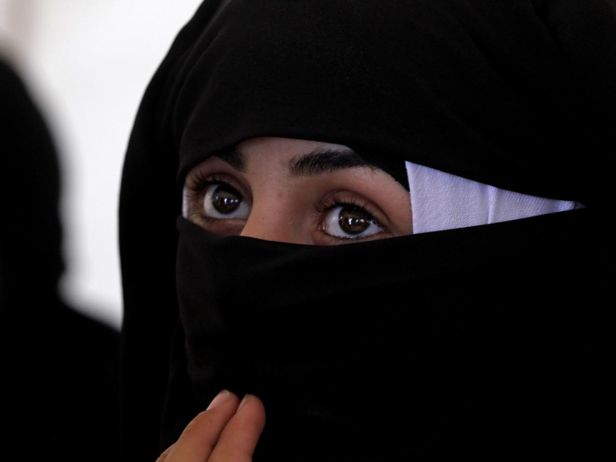 A Syrian woman at a camp for displaced people in al-Hasakah, a neighbouring province of the area where Isis took around 250 people captive: AFP/Getty