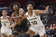 Baylor's NaLyssa Smith (1) and Michigan's Naz Hillmon (0) look for a rebound in the first half of an NCAA college basketball game, Sunday, Dec. 19, 2021, in Uncasville, Conn. (AP Photo/Jessica Hill)