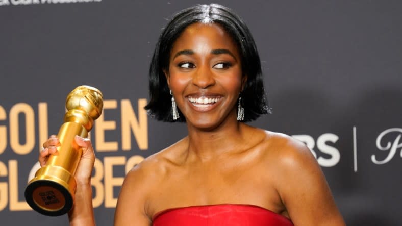 Ayo Edebiri holds the award she won for best female actor in a television comedy for “The Bear” at the 81st Golden Globe Awards on Sunday. (Photo: Chris Pizzello/AP)