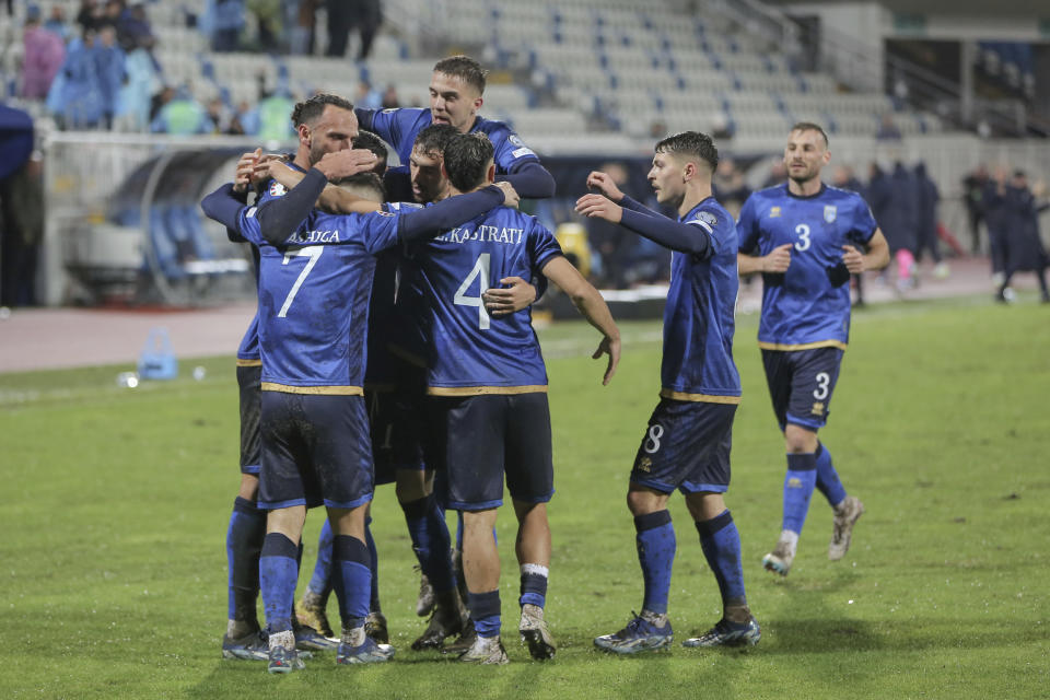 Kosovo's players celebrate the opening goal during the Euro 2024 group I qualifying soccer match between Kosovo and Israel at the Fadil Vokrri stadium in Pristina, Kosovo, Sunday, Nov. 12, 2023. (AP Photo/Visar Kryeziu)