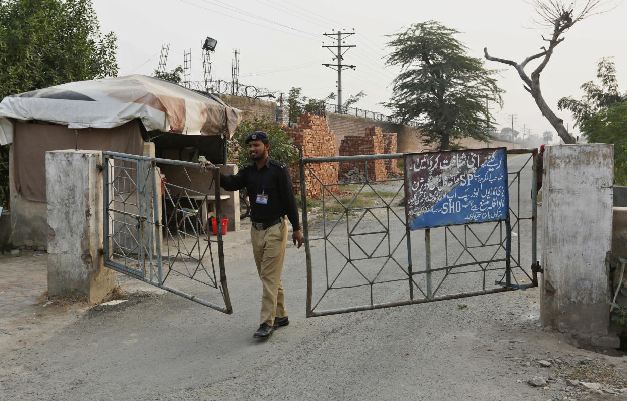 A police officer stands guard at a checkpoint of Kot Lakhpat prison, where Czech model Tereza Hluskova detain, in Lahore, Pakistan, Friday, Nov. 5, 2021. Hluskova, who was sentenced to eight years on charges of attempting to smuggle heroin from Pakistan to Abu Dhabi will be freed next week following her acquittal by an appeal court, a defense lawyer said Friday. (AP Photo/K.M. Chaudary)
