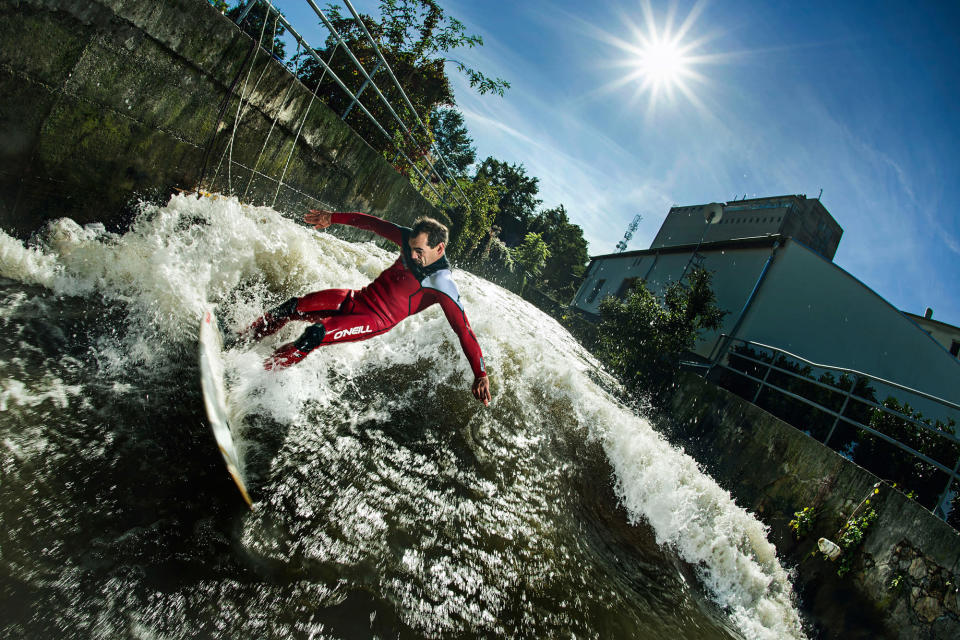 A daredevil surfer catches some waves on a river in landlocked Austria. The picture, taken by his friend Philip Platzer, shows Peter Bartl balancing precariously on his surfboard. The sport is difficult to master as the currents are fast and unseen obstacles lurk just below the water's surface (Caters)