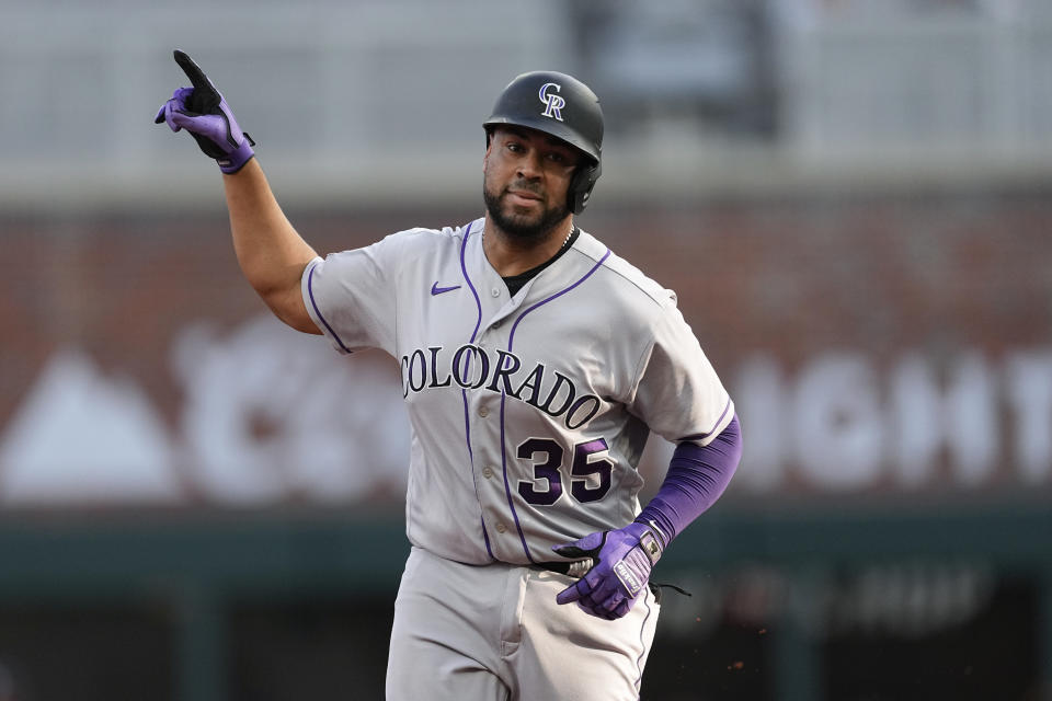 Colorado Rockies' Elias Diaz gestures while running the bases on a solo home run against the Atlanta Braves during the second inning of a baseball game Thursday, June 15, 2023, in Atlanta. (AP Photo/John Bazemore)