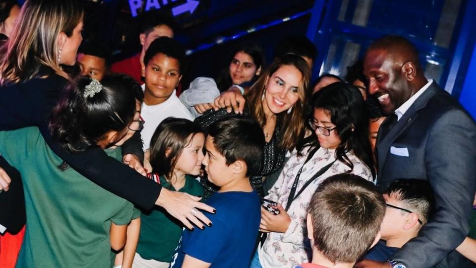 Children from Big Brothers Big Sisters of Miami at an “All in for Smiles” day of fun event surround Leila Centner, co-founder of the David and Leila Centner Family Foundation, in December 2019.