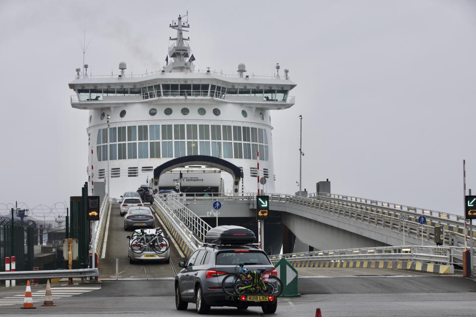 Cars are loaded onto a cross-channel ferry at the Port of Dunkerque, France, Friday Aug.14, 2020. British holiday makers in France were mulling whether to return home early Friday to avoid having to self-isolate for 14 days following the U.K. government's decision to reimpose quarantine restrictions on France amid a recent pick-up in coronavirus infections. (AP Photo/Olivier Matthys)