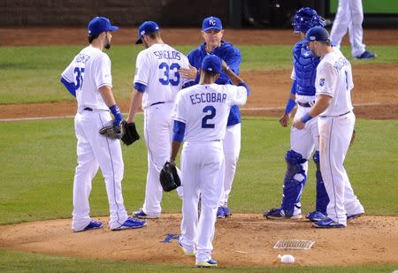 Oct 21, 2014; Kansas City, MO, USA; Kansas City Royals starting pitcher James Shields (33) is relieved by manager Ned Yost (middle rear) in the fourth inning against the San Francisco Giants during game one of the 2014 World Series at Kauffman Stadium. Christopher Hanewinckel-USA TODAY Sports