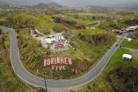 <p>A mural that reads in Spanish “Boriken is alive” is seen a week after the passage of Hurricane Maria in Cayey, Puerto Rico, on Sept. 27, 2017. Boriken is the pre-Columbian Taino name of today’s Puerto Rico. (Photo: Ricardo Arduengo/AFP/Getty Images) </p>