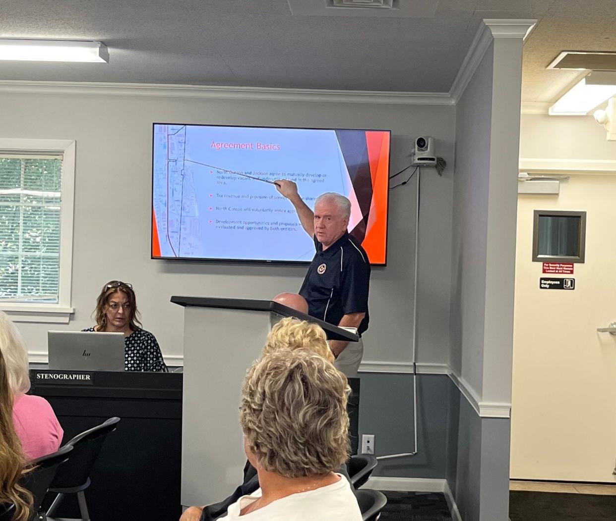 North Canton's administrator, Patrick DeOrio, briefs North Canton council members last week on the terms of a proposed shared development agreement with Jackson Township.