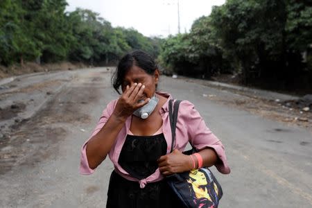 Eufemia Garcia, 48, who lost 50 members of her family during the eruption of the Fuego volcano, reacts after a day searching for her family in San Miguel Los Lotes in Escuintla, Guatemala, June 15, 2018. REUTERS/Carlos Jasso