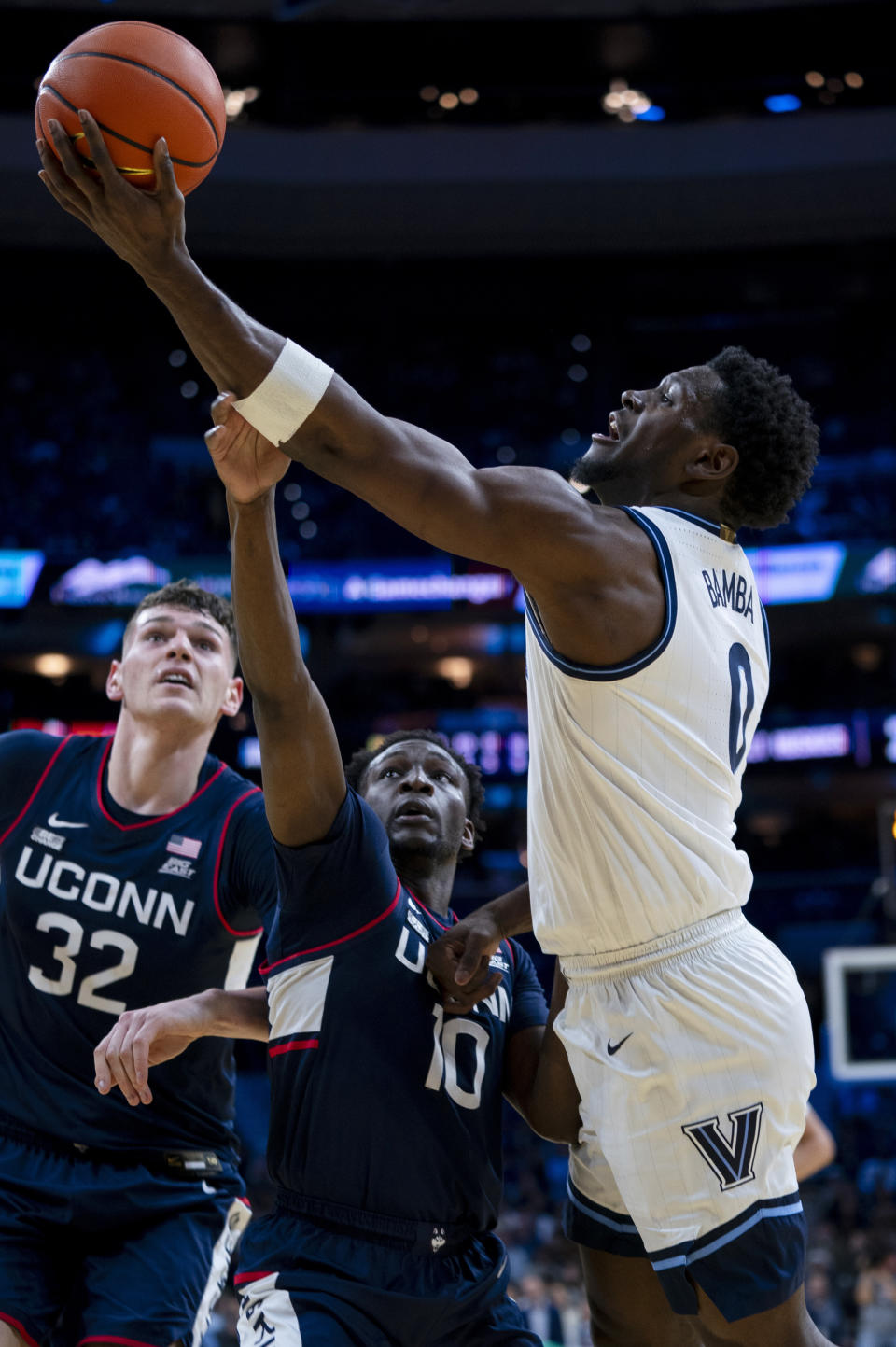 Villanova's TJ Bamba, rights, shoots as he is fouled by UConn's Hassan Diarra during the first half of an NCAA college basketball game Saturday, Jan. 20, 2024, in Philadelphia. (AP Photo/Chris Szagola)