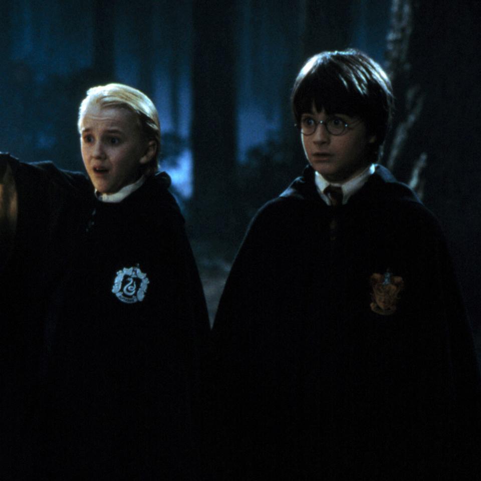 Tom Felton, left, as Draco Malfoy and Daniel Radcliffe as Harry Potter. (Photo: Warner Bros.)