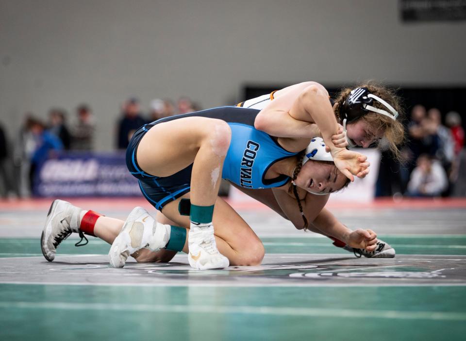 Dallas’ Polly Olliff wrestles Corvallis’ Jennifer Russell in the OSAA 6A/5A state championships on Saturday, Feb. 24, 2024 at Veterans Memorial Coliseum in Portland, Ore.