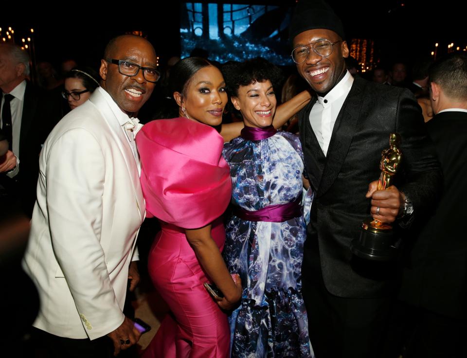 Courtney B. Vance, from left, Angela Bassett, Amatus Sami-Karim and Mahershala Ali, winner of the award for best performance by an actor in a supporting role for "Green Book," attend the Governors Ball after the Oscars on Sunday, Feb. 24, 2019, at the Dolby Theatre in Los Angeles. (Photo by Eric Jamison/Invision/AP) ORG XMIT: CADA707