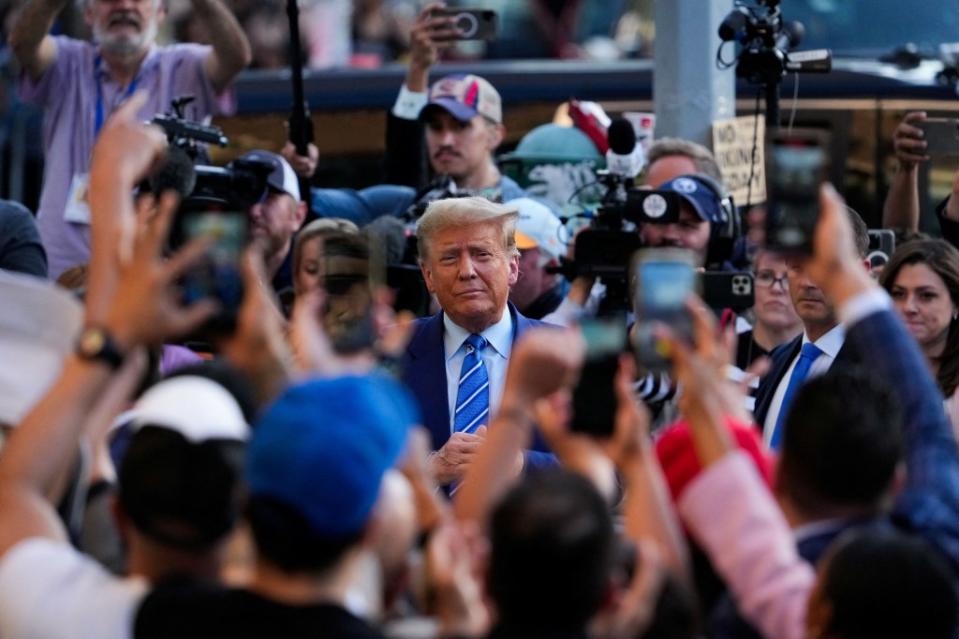 Crowds were present to greet Trump at the bodega. REUTERS