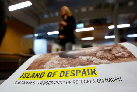 Anna Neistat, Senior Director for Research with Amnesty International, talks to journalists behind a copy of a report she co-authored titled 'Island of Despair - Australia's "Processing" of Refugees on Nauru' in Sydney, Australia, October 17, 2016 that concludes many of the 410 asylum seekers held on the tiny Pacific Island are being driven to attempt suicide to escape the prison-like conditions they face in indefinite detention on behalf of Australia. REUTERS/David Gray