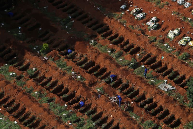 FILE PHOTO: Gravediggers open new graves as the number of dead rose after the coronavirus disease (COVID-19) outbreak, at Vila Formosa cemetery, Brazil's biggest cemetery, in Sao Paulo