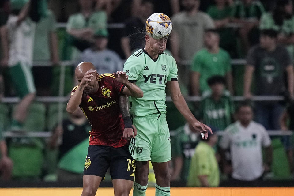 Austin FC defender Julio Cascante, right, heads the ball past Seattle Sounders FC forward Heber during the second half of an MLS soccer match in Austin, Texas, Wednesday, Aug. 30, 2023. (AP Photo/Eric Gay)