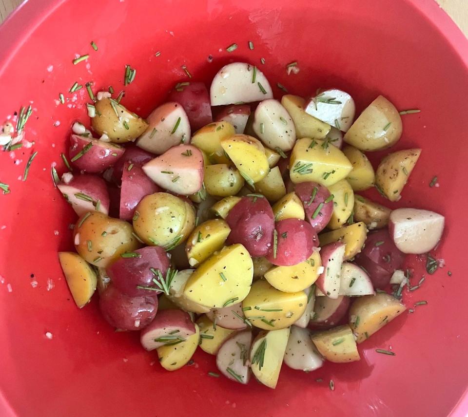 Mixing Ina Garten's roasted rosemary potatoes
