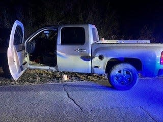 Stationary vehicle where officers from the Washington County Sheriff's Office found the defendant, parrot and several illegal items on Elkcam Road.