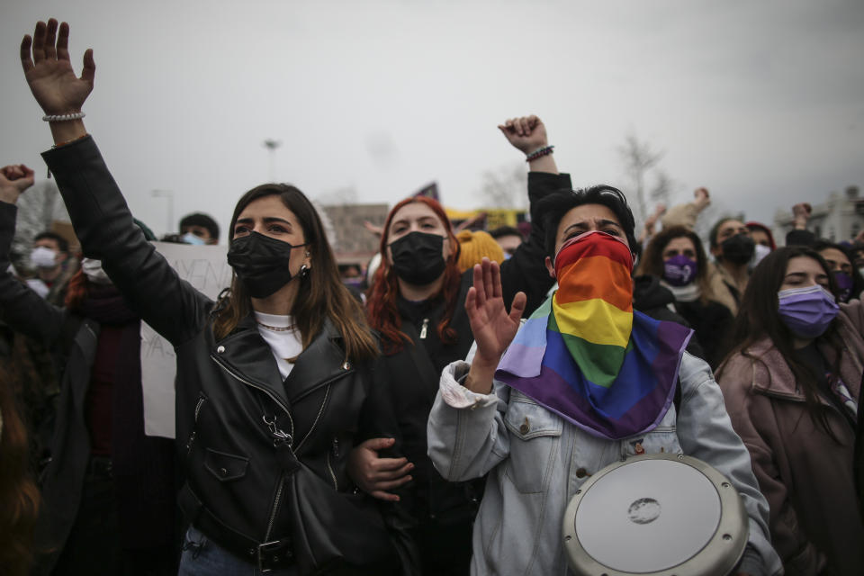 Protesters chat slogans during a rally in Istanbul, Saturday, March 2021, 2021. Turkey's President Recep Tayyip Erdogan's overnight decree annulling Turkey's ratification of the Istanbul Convention is a blow to women's rights advocates, who say the agreement is crucial to combating domestic violence. Turkey was the first country to sign 10 years ago and that bears the name of its largest city. (AP Photo/Emrah Gurel)