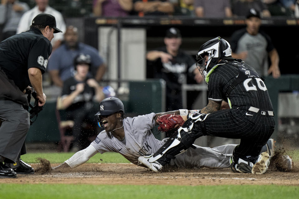 Jazz Chisholm appeared to injure his elbow on this head-first slide. (Matt Dirksen/Getty Images)