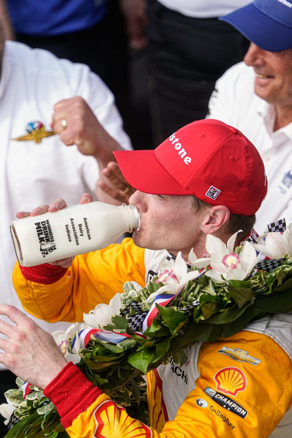 Team Penske driver Josef Newgarden (2) drinks the bottle of milk in victory lane on Sunday, May 28, 2023, after winning the 107th running of the Indianapolis 500 at Indianapolis Motor Speedway.