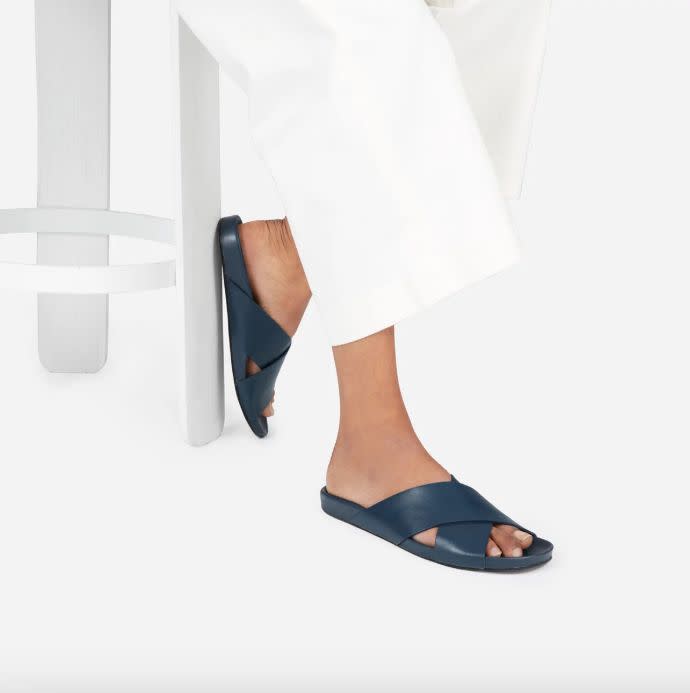 Get it at <a href="https://www.everlane.com/products/womens-molded-lthr-cross-slide-sandal-navy?collection=womens-newest-arrivals" target="_blank">Everlane</a>, $118.