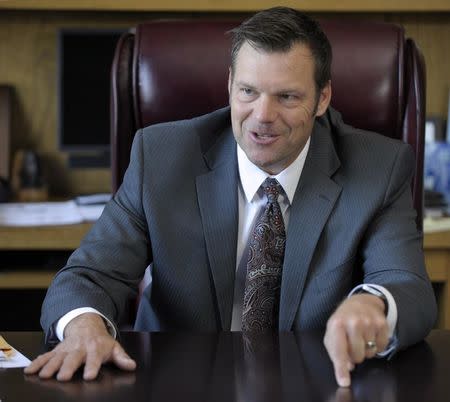 Kansas Secretary of State Kris Kobach talks about the Kansas voter ID law that he pushed to combat what he believes to be rampant voter fraud in the United States in his Topeka, Kansas, U.S., office May 12, 2016. REUTERS/Dave Kaup