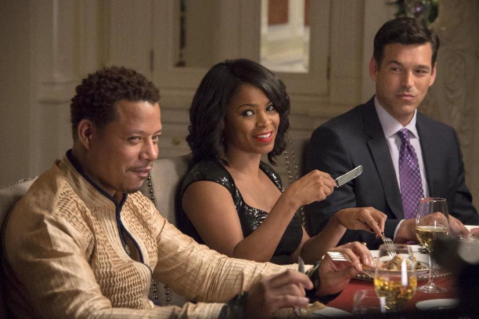 This image released by Universal Pictures shows, from left, Terrence Howard, Nia Long and Eddie Cibrian in a scene from "The Best Man Holiday." The movie releases in theaters Friday, Nov. 15, 2013. (AP Photo/Universal Pictures, Michael Gibson)