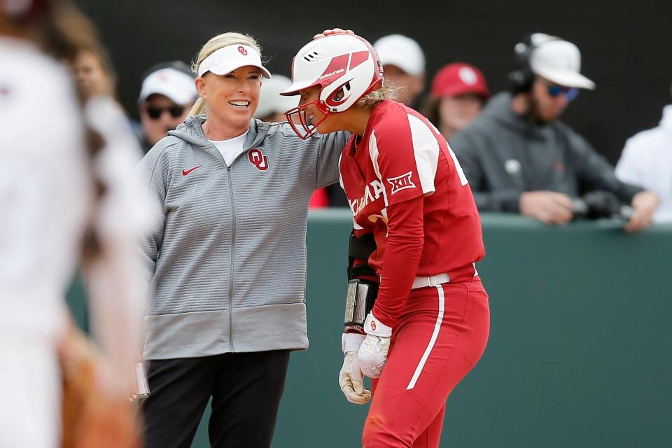 OU softball coach Patty Gasso (left) talks with Jayda Coleman during Saturday's 3-2 regional win over Texas A&M in Norman.