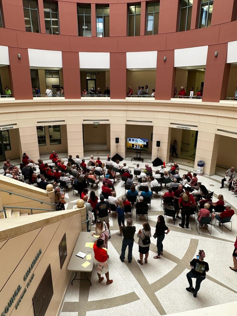 People who wanted to attend Wednesday night's Volusia County Council meeting couldn't all fit in council chambers, so different areas had to be set up for the overflow crowd to listen in on the meeting.