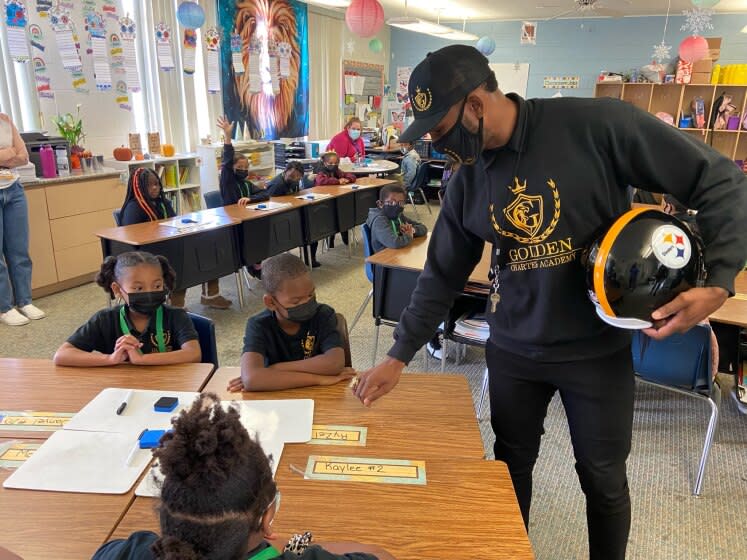 Former Steelers safety Rob Golden works with students at Golden Charter Academy in Fresno, Calif., on Nov. 18, 2021.