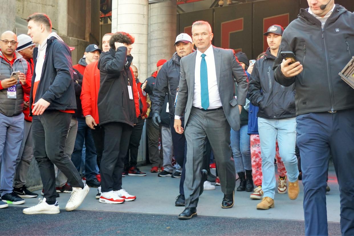Former Ohio State coach and current Fox television analyst Urban Meyer enters Ohio Stadium prior to the Buckeyes' game against Michigan Nov. 26, 2022.