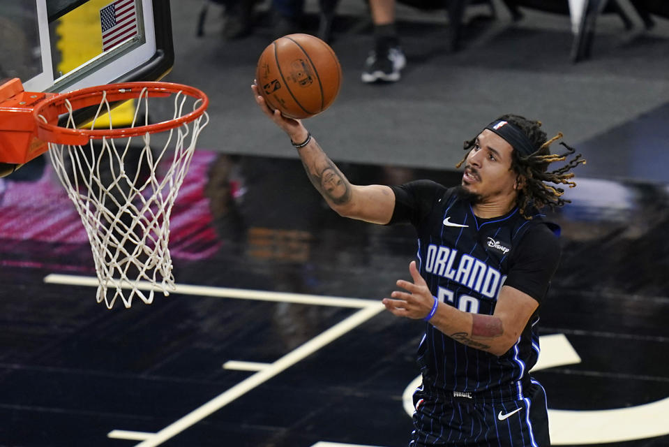 Orlando Magic guard Cole Anthony makes a shot against the Charlotte Hornets during the first half of an NBA basketball game, Monday, Jan. 25, 2021, in Orlando, Fla. (AP Photo/John Raoux)