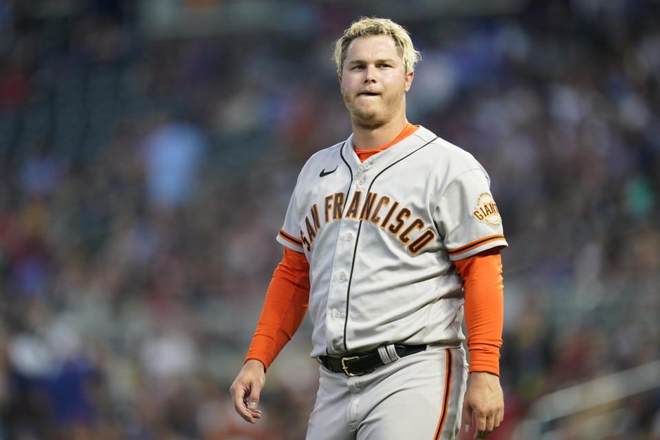 San Francisco Giants' Joc Pederson reacts after striking out to end the top of the third inning of a baseball game against the Minnesota Twins, Friday, Aug. 26, 2022, in Minneapolis. (AP Photo/Abbie Parr)